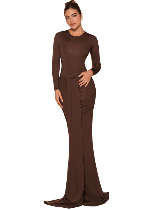 Woman wearing a brown long-sleeve gown 