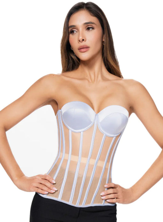 Woman wearing a pale blue corset 