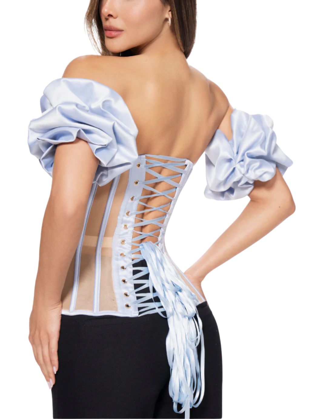 Woman wearing a light blue off-shoulder top with a lace-up back 