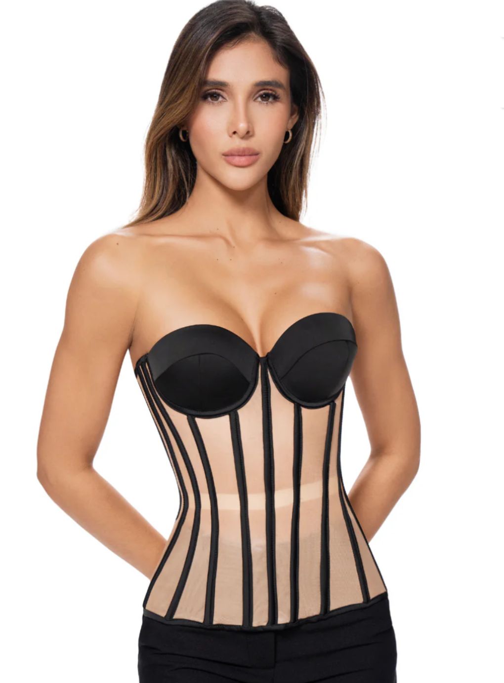 Woman wearing a black and beige corset 